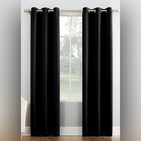 Four (4) black curtain panels. Metal grommets fit rods up to 1.5" in diameter. - Picture 1 of 5